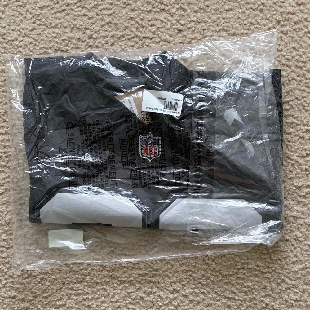 Authentic NFL Black and White LV Raiders Team Jersey. Brand new with tags!!!